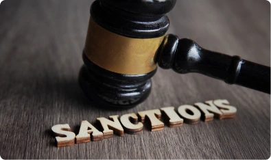 Mazo de juez junto a la palabra sanctions